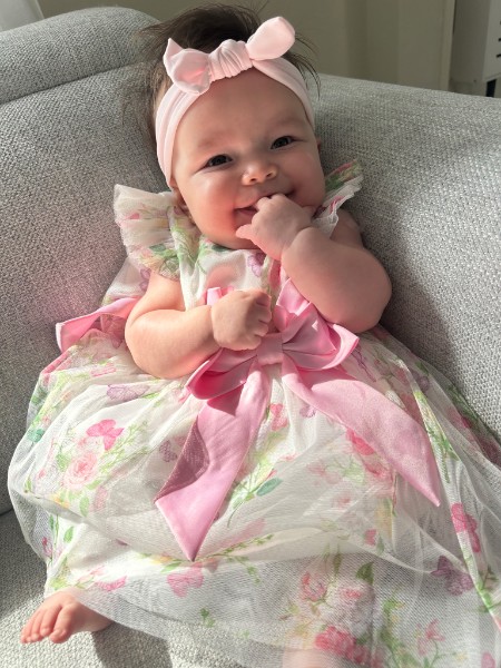 Coral in her pink floral dress
