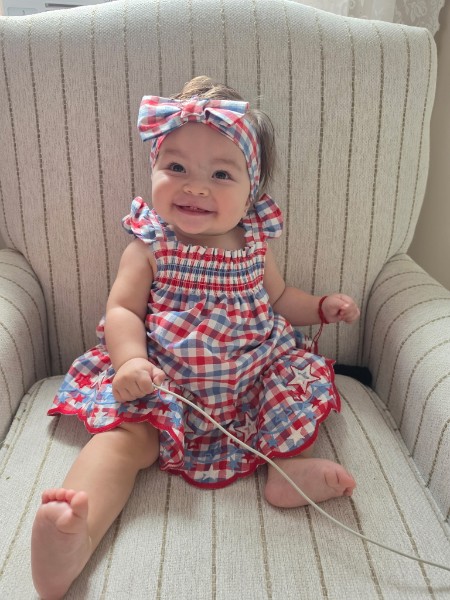 Coral in a gingham dress