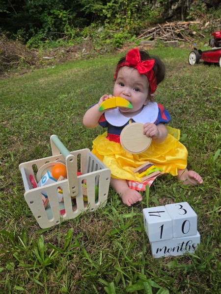 Coral with her ten-month milestone sign